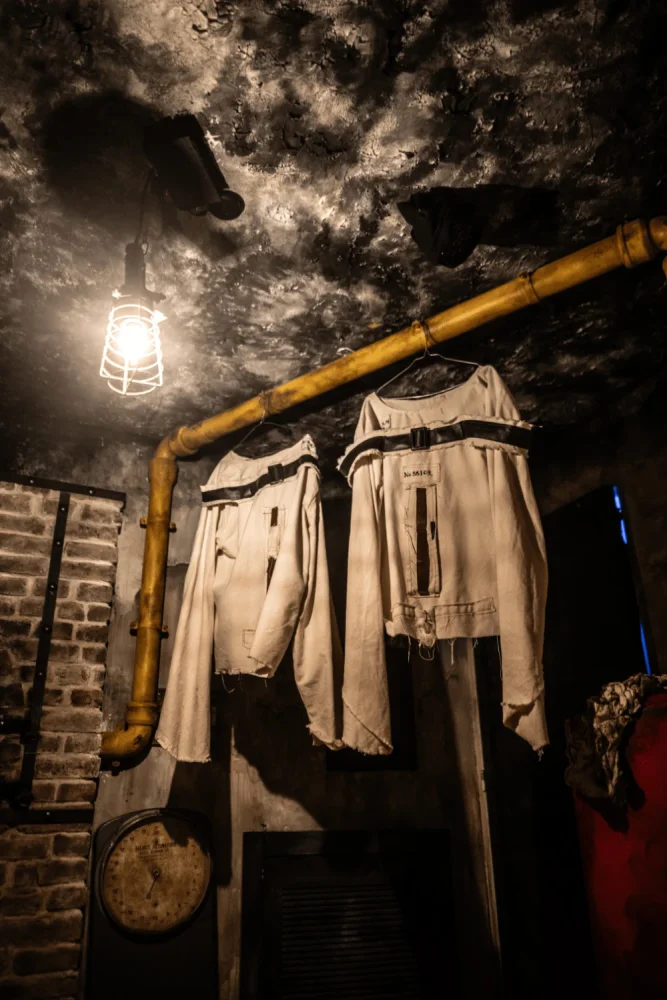 a very dark room with the boiler