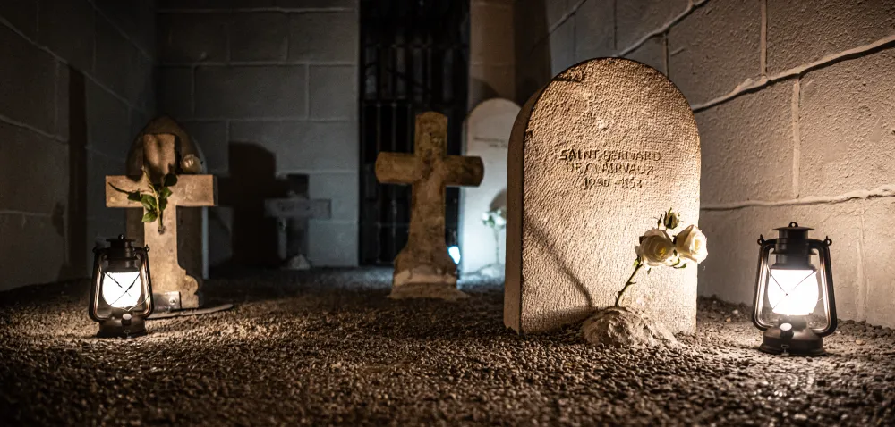 Graves lit by lanterns in the Templar graveyard